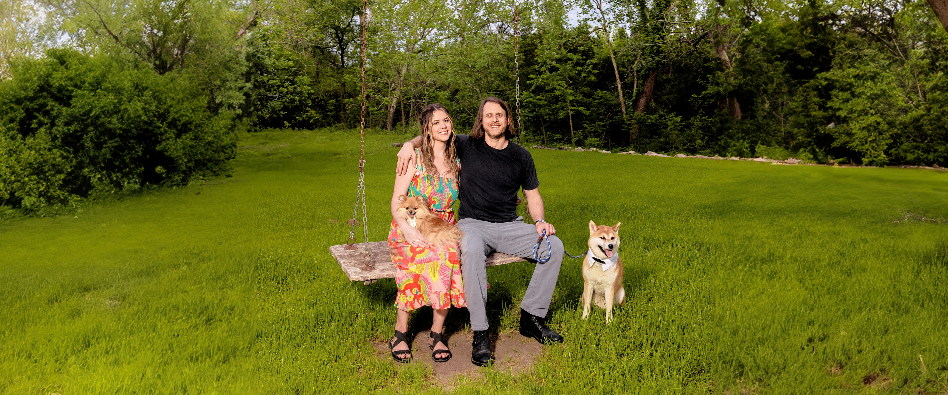 Susie and James on a swing with their dogs in a green field